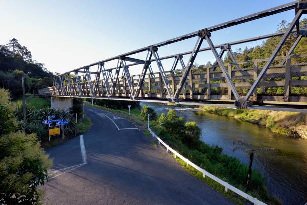 istock A metal footbridge spanning a road and a river 942849706
