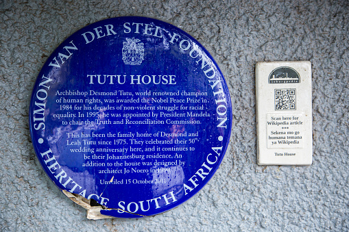 The heritage plaque on the wall surrounding Desmond Tutu's house on Bacela Street in Soweto.
