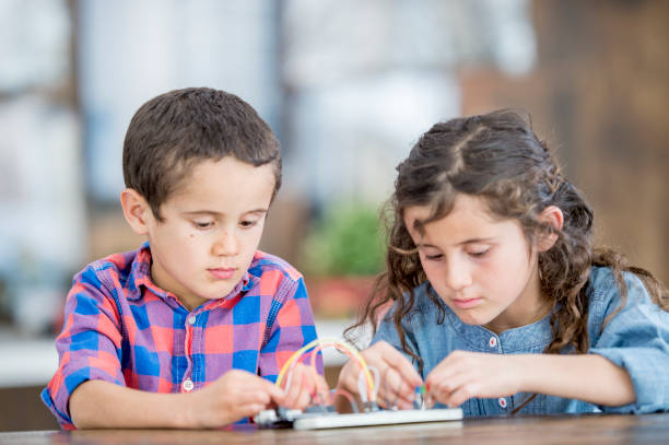 istock Brother And Sister Working Together 942856528