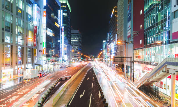 istock Traffic and people moving through Osaka at night 942857552