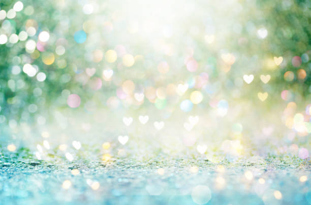istock Beautiful shiny hearts and abstract lights 942857770