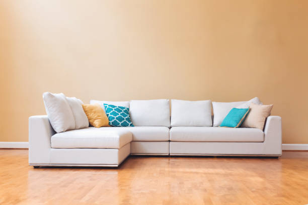 istock White couch in a large luxury home 942857894