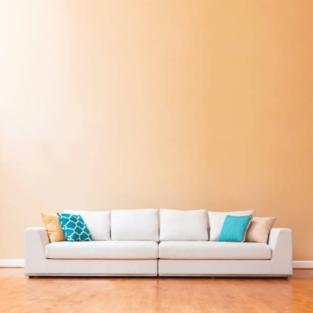 istock White couch in a large luxury home 942857908