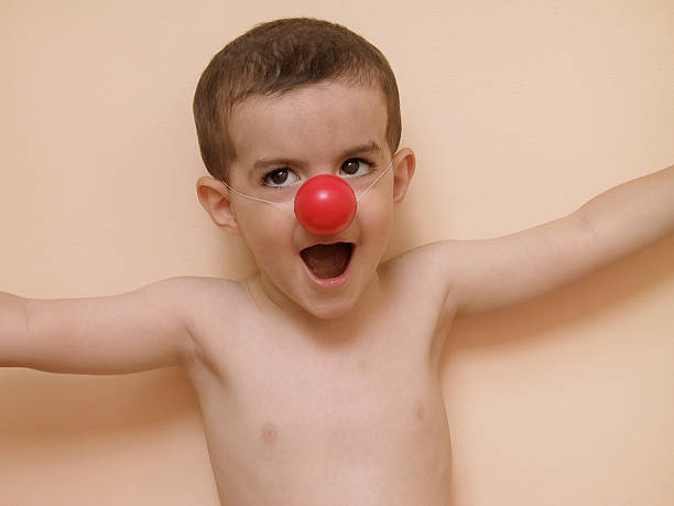 istock Boy with red clown nose 94285916