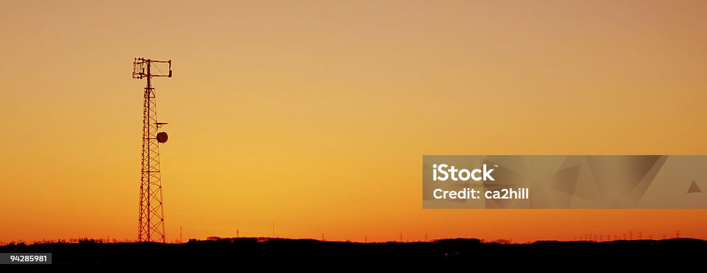 Orange Cell Tower Silhouette  Repeater Tower Stock Photo