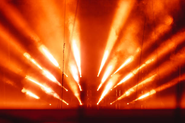 spotlight in smoke The light rays from the spotlight through the smoke. Lighting equipment on the ceiling. The stage of a theatre or night club. Show or performance. rock group photos stock pictures, royalty-free photos & images