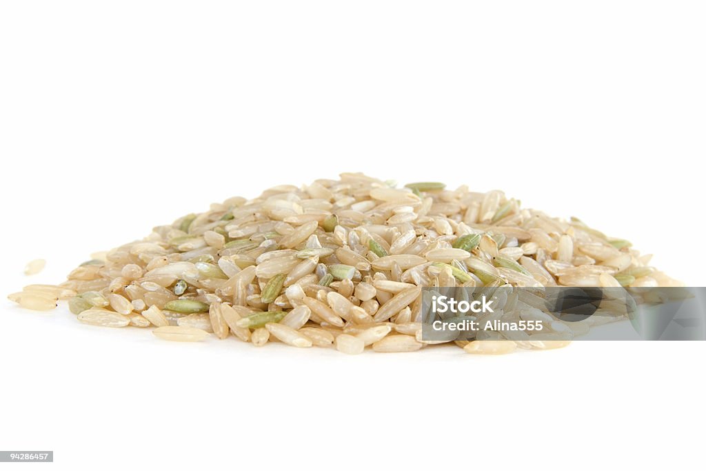 Pile of brown rice on white  Black Color Stock Photo