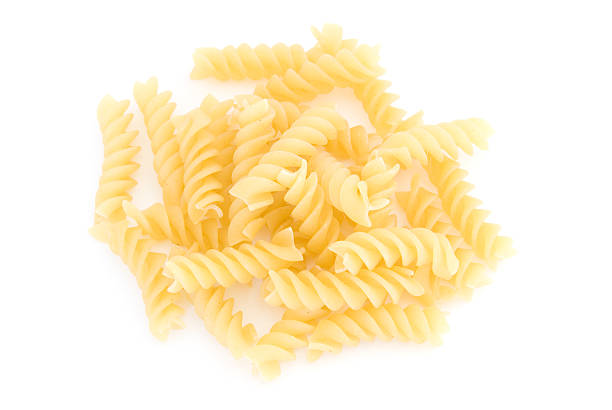 istock Pile of rotini on white 94286500