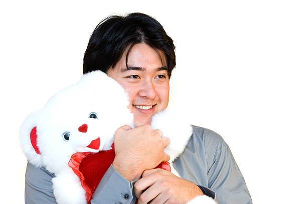 Head of a white stuffed dog with a red bow