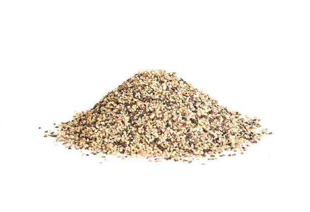 istock Pile of coarse ground black pepper on white 94286717