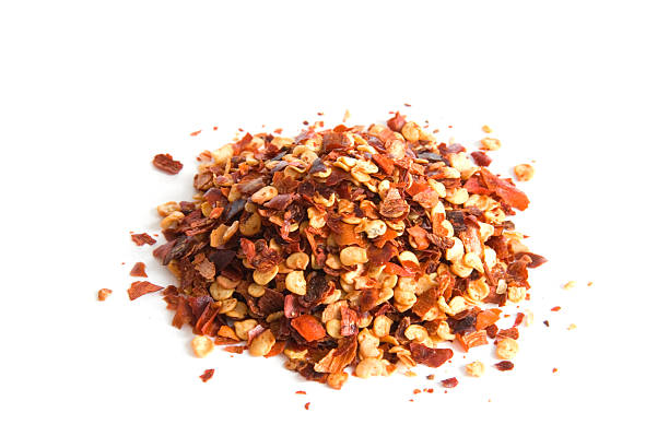 Pile of red pepper flakes on white