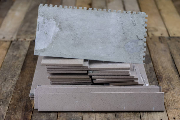 istock Laying and cutting tiles. Tools and building materials at a working position. Tiles for industrial and technical applications. Material Gres. 942869594