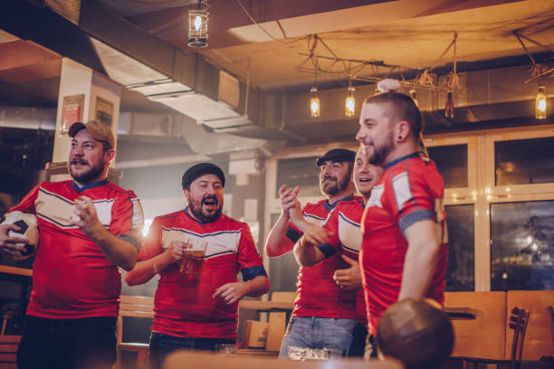 istock Soccer fans watching game 942869604