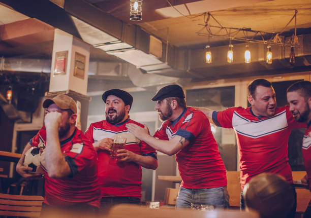 istock Sports fans watching game 942869696