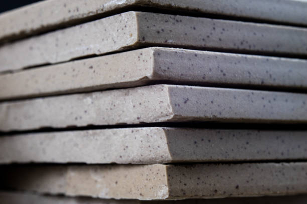 Laying and cutting tiles. Tools and building materials at a working position. Tiles for industrial and technical applications. Material Gres.