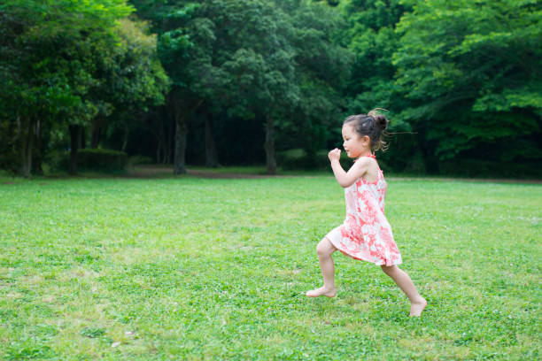 istock Little girl runs 942874368