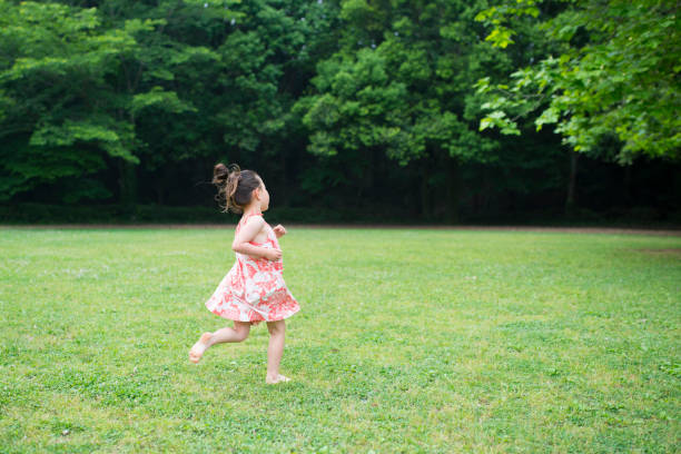 istock Little girl runs 942874406