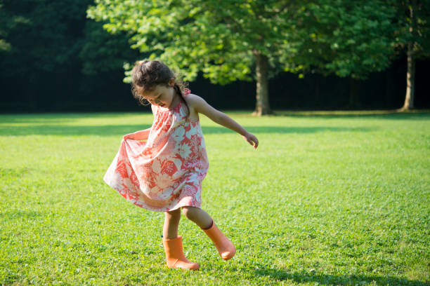 istock Little girls playing on the lawn 942874548