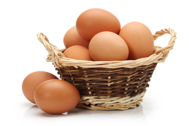 istock Basket With Eggs   isolated on the white background 942881836