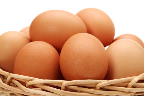istock Basket With Eggs   isolated on the white background 942882030