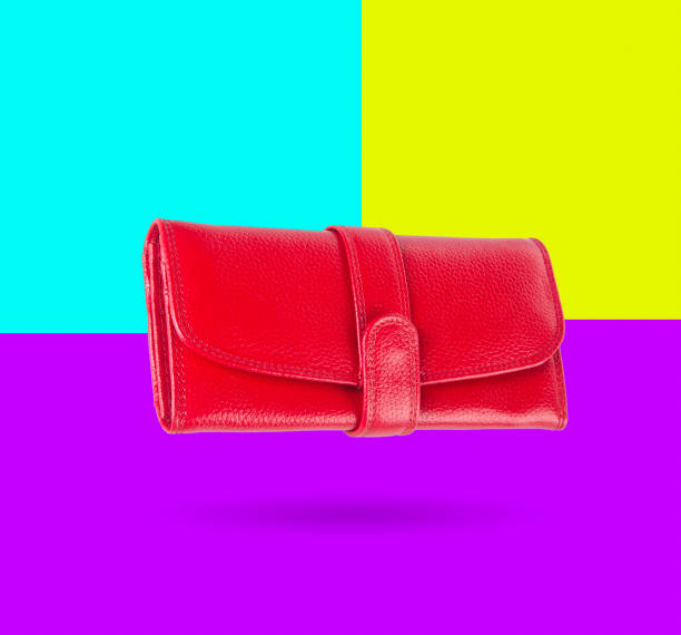 istock wallet. woman wallet on background 942882900