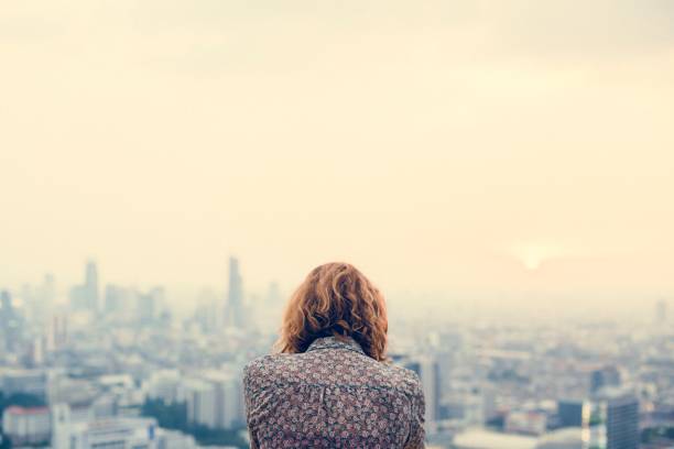 istock Blond woman at a rooftop 942883018