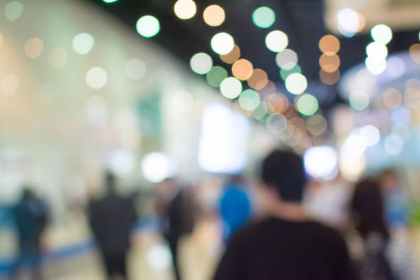 istock Abstract blurred image of crowd people in exhibition show 942883048