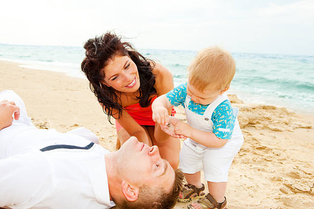 istock Happy family at the beach 94288421