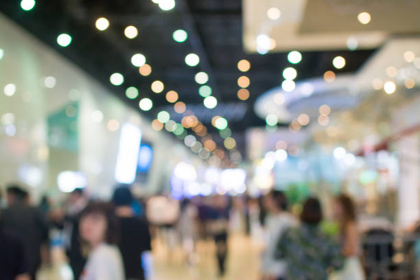 istock Abstract blurred image of crowd people in exhibition show 942885078