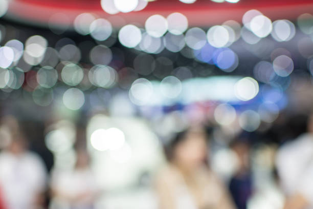 istock Abstract blurred image of crowd people in exhibition show 942885080