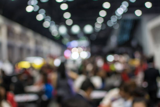 istock Abstract blurred image of crowd people in exhibition show 942885094