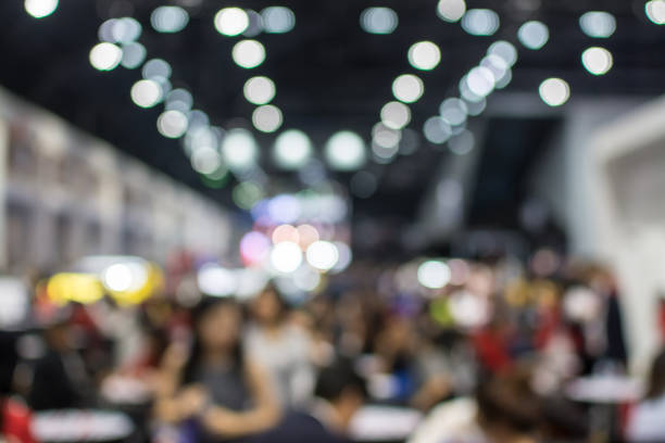 istock Abstract blurred image of crowd people in exhibition show 942885116