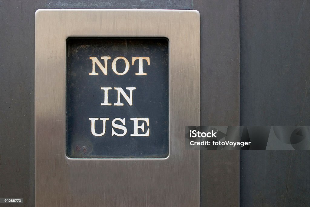 Sign in metal frame Out of order sign in brushed stainless steel frame, surround by dark metal background. Absence Stock Photo