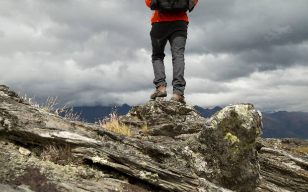 Lower torso of hiker on summit ridge