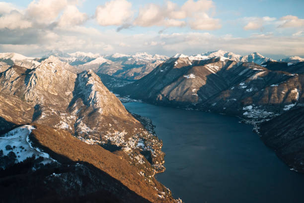 It's a clear day with lofty clouds.  Shot from summit peak, Ticino Canton