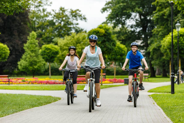 istock Urban biking- three people riding bikes in city 942895048