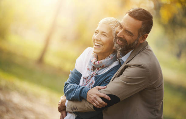 istock Mid aged couple in a park 942905752