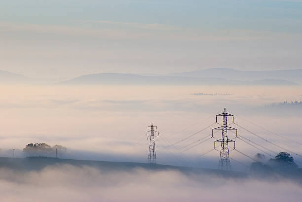 istock Electricity pylons in mist 94290947