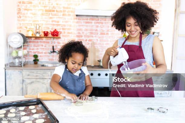 Mother And Daughter Mixing Cookies Stock Photo - Download Image Now - Chef, Baking, Child
