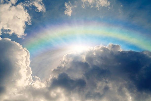 Blue Sky With Rainbow and Sun Reflection Blue Sky With Rainbow and Sun Reflection refraction photos stock pictures, royalty-free photos & images