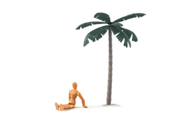 Wooden mannequin sitting on lonely island under a palm