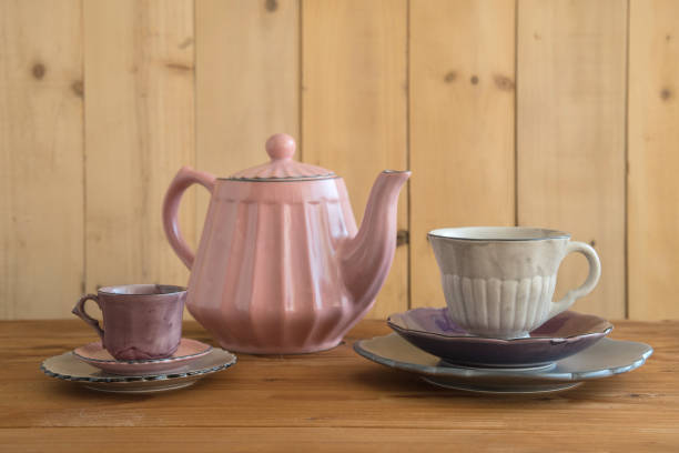 istock Teapot with teacup  ceramic on wood background. 942917266