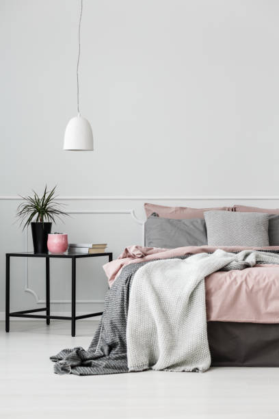 istock Grey and pink bedroom interior 942917374