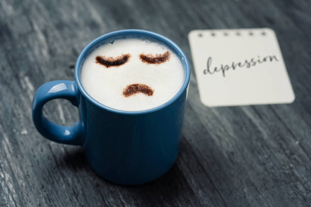 istock cup of cappuccino with a sad face 942919908