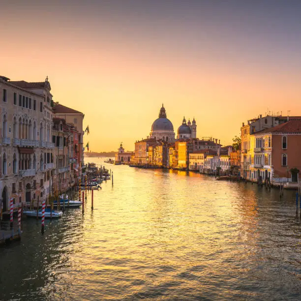 Photo of Venice grand canal, Santa Maria della Salute church landmark at sunrise. Italy