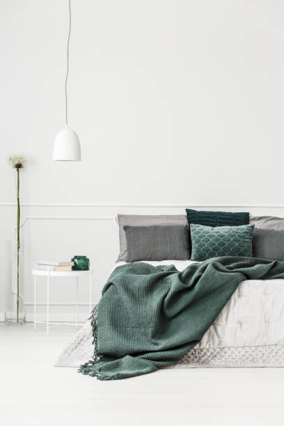 istock Green and white bedroom interior 942920778