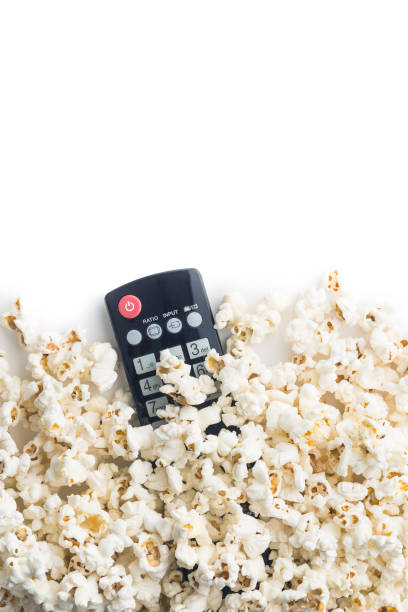 istock Tasty popcorn and tv remote control. 942920810