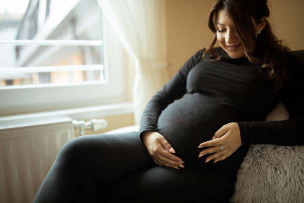 istock Pregnant woman resting at home 942923700