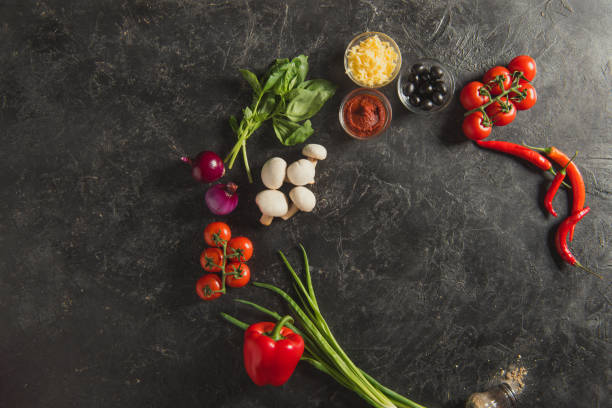 istock flat lay with arranged fresh ingredients for pizza on dark tabletop 942927282