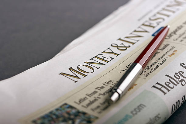istock Red pen on the business newspaper 94292999